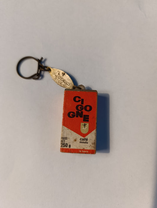 Porte-clés publicitaire vintage Café Cigogne – boîte miniature avec grains