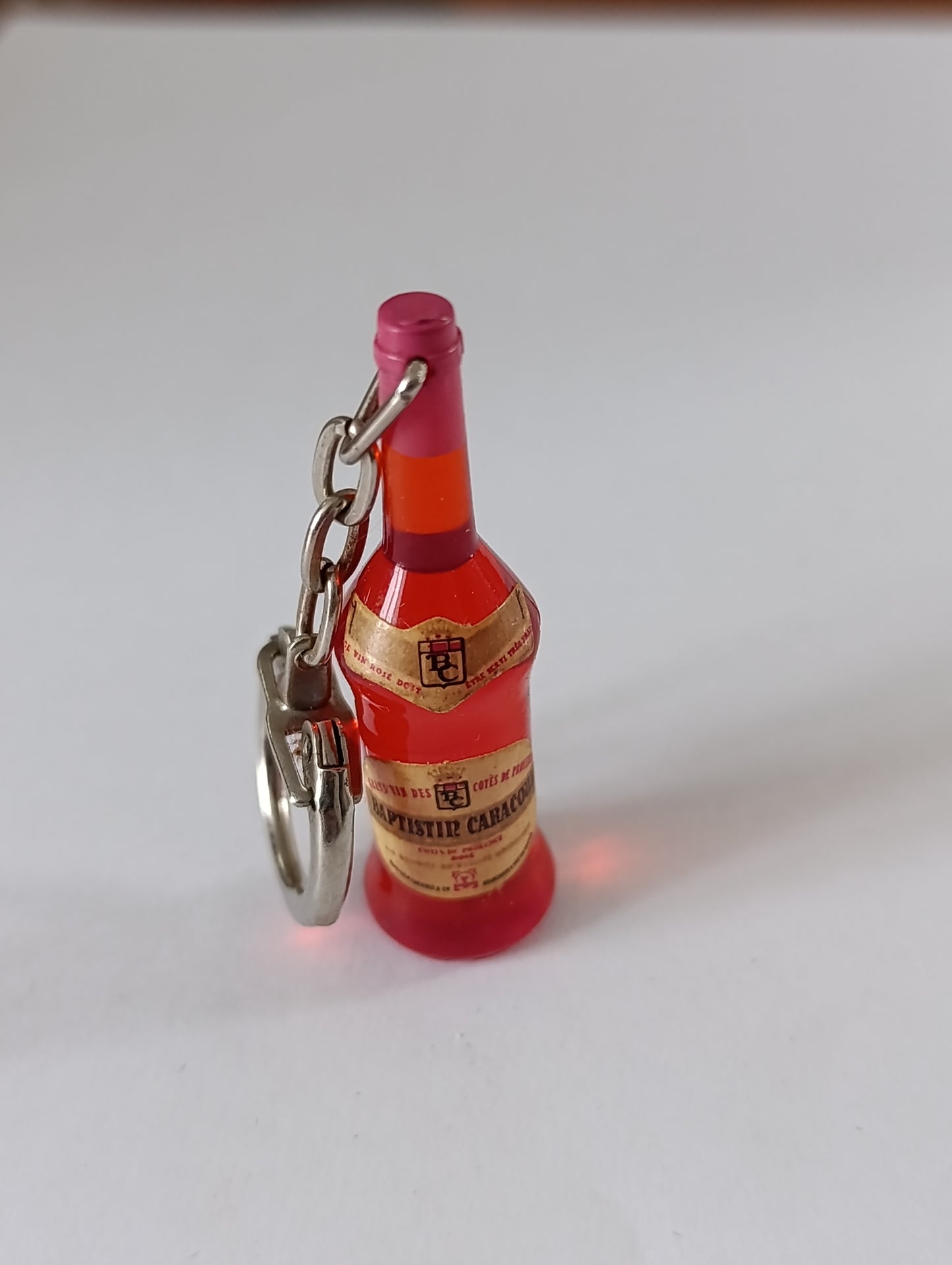 Porte-clés ancien bouteille miniature Capistille Caraçon