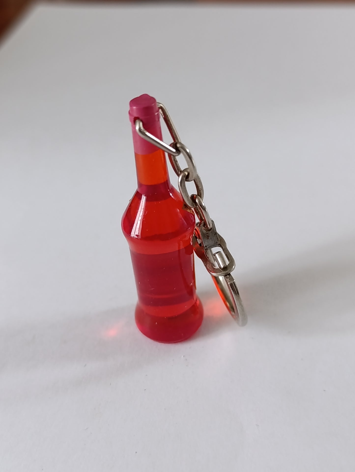 Porte-clés ancien bouteille miniature Capistille Caraçon