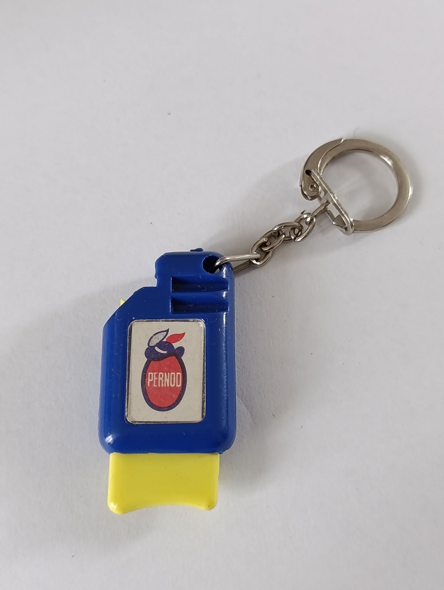 Porte-clés publicitaire ancien Pernod perforateur de tickets de tiercé
