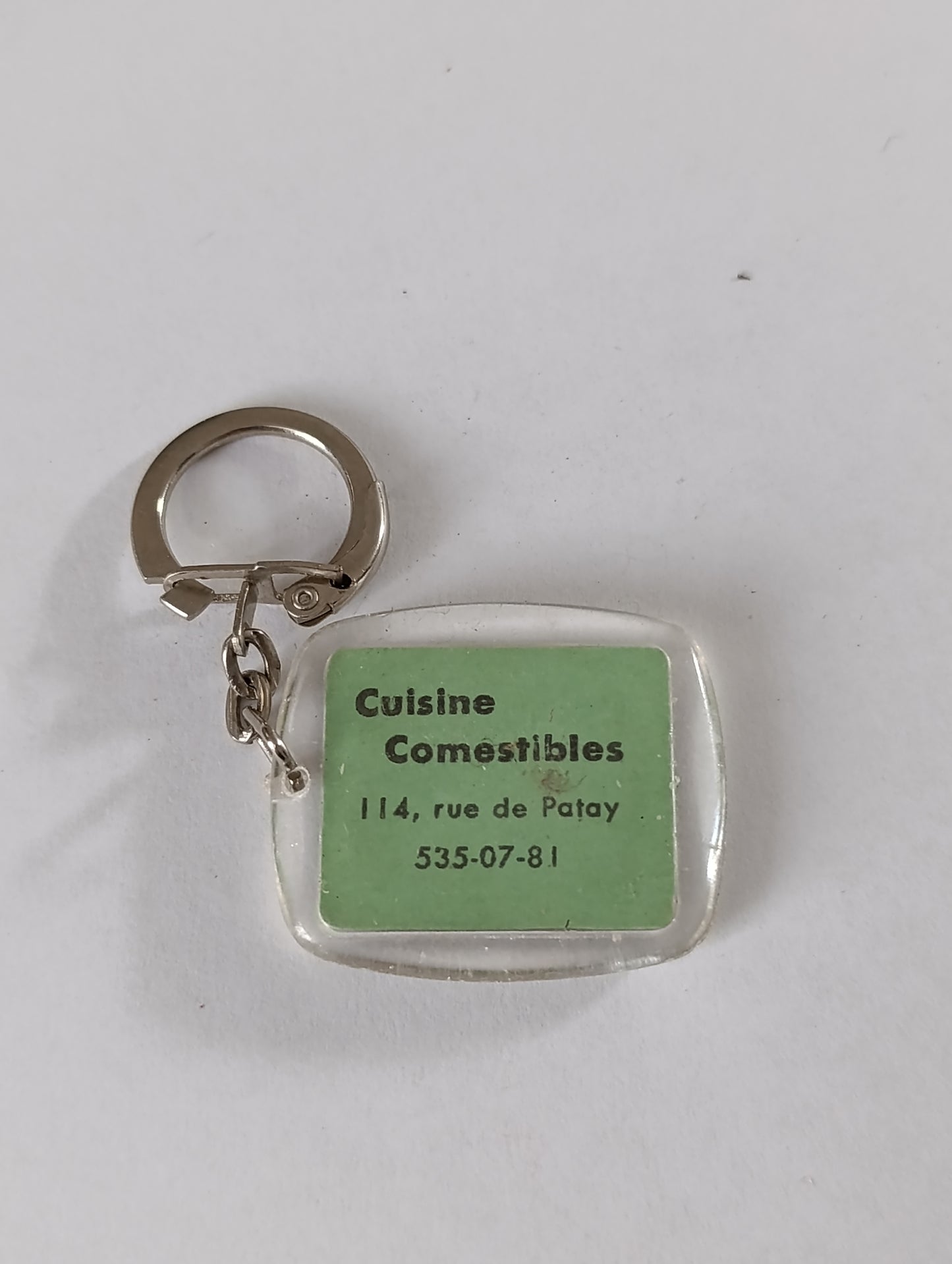 Porte-clés publicitaire ancien Cuisine Comestibles – rue de Patay