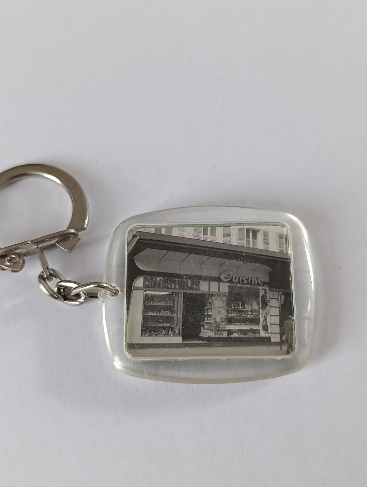 Porte-clés publicitaire ancien Cuisine Comestibles – rue de Patay